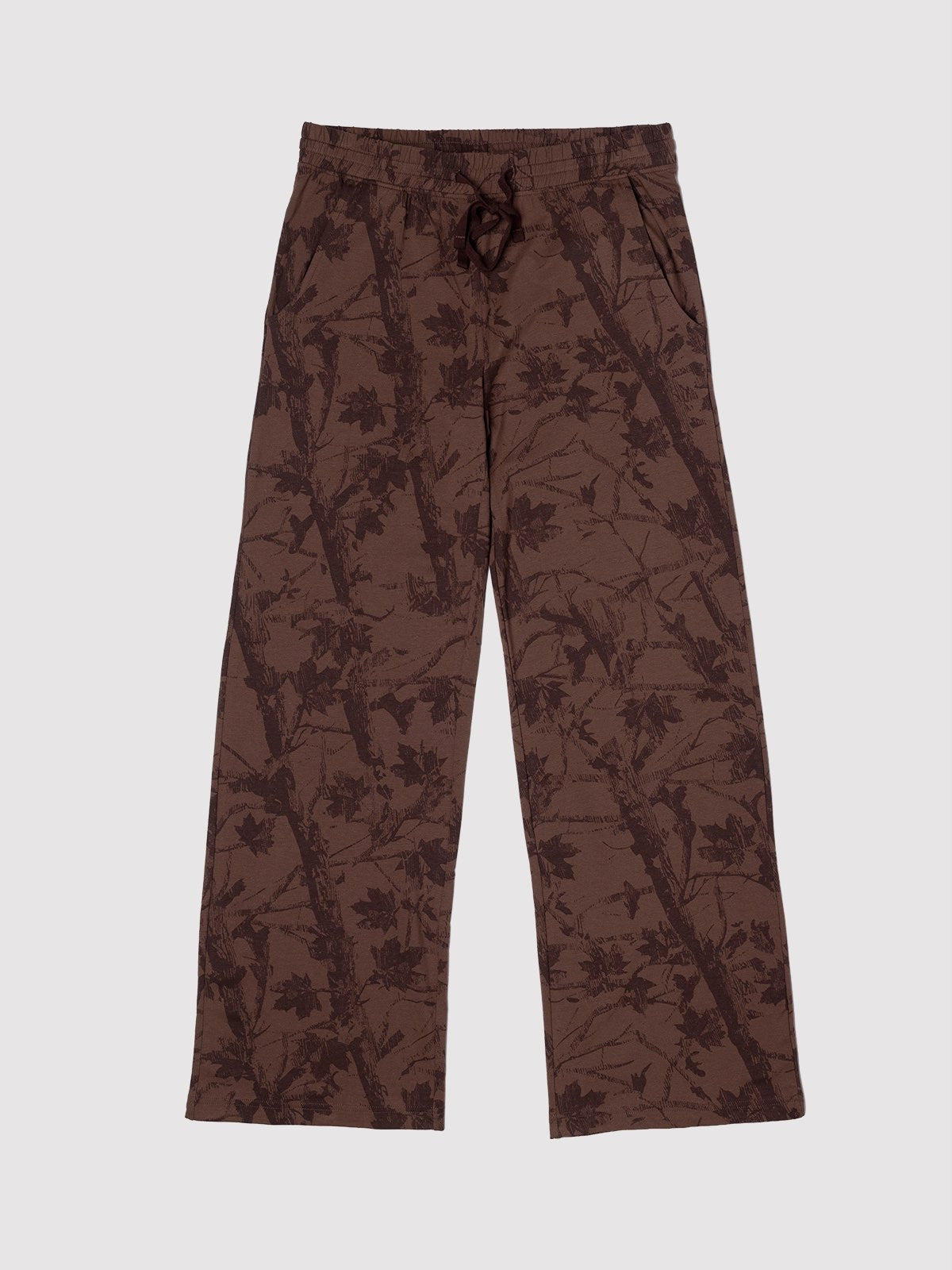 A pair of brown wide-leg pants featuring an all-over dark brown leafy branch pattern, shown flat against a light gray background.